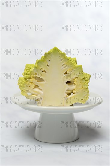 Halved cauliflower Romanesco on a decorative plate