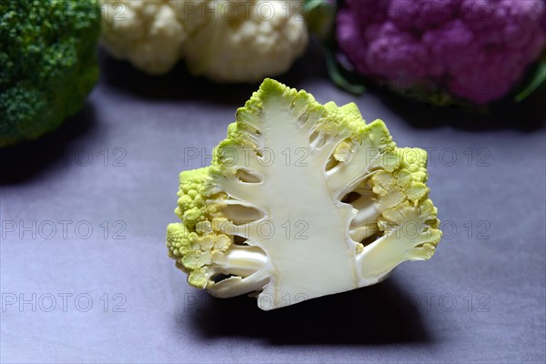 Halved cauliflower Romanesco and purple and white cauliflower