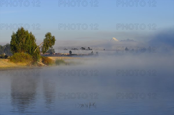 Morning fog over the lake Laguna Piuray