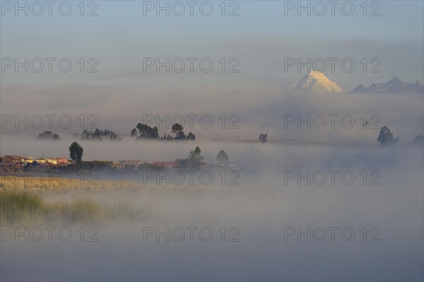 Morning fog over the lake Laguna Piuray