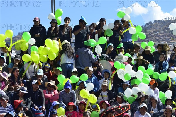 Spectator stand with balloons at the Plaza de Armas during a parade