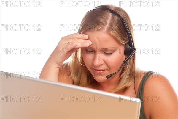 Fatigued businesswoman talks on her phone headset