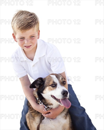 Handsome young boy playing with his dog isolated on a white background