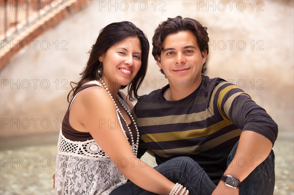 Happy attractive hispanic couple enjoying themselves at the park