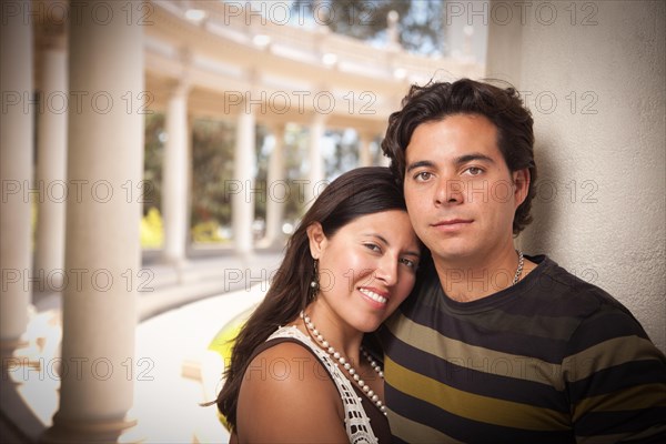 Happy attractive hispanic couple enjoying themselves at the park