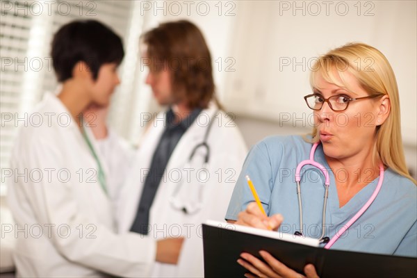 Alarmed medical woman witnesses her colleagues inner office romance display