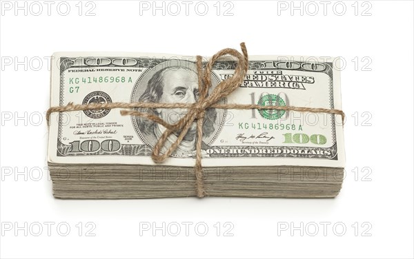 Stack of one hundred dollar bills tied in a burlap string isolated on a white background