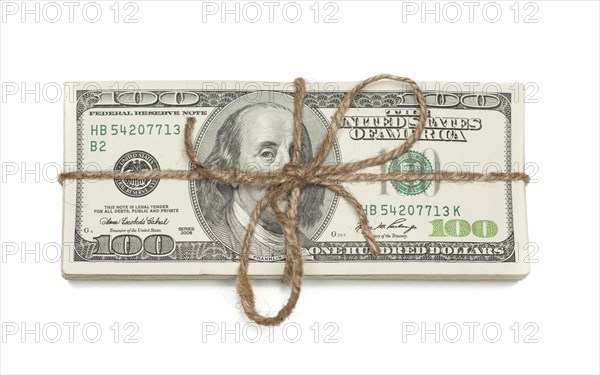 Stack of one hundred dollar bills tied in a burlap string isolated on a white background
