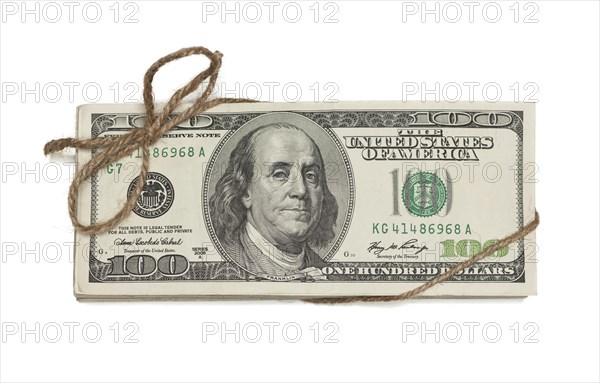 Stack of one hundred dollar bills tied in a burlap string isolated on a white background
