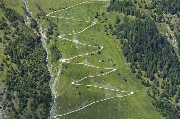 Zigzag hiking trail on a mountain slope