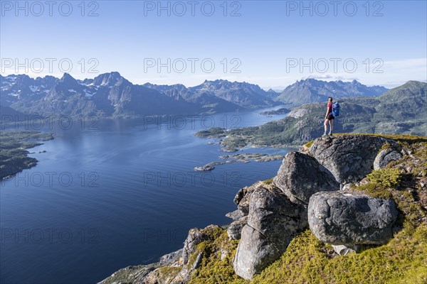 Young hiker looking at mountain panorama