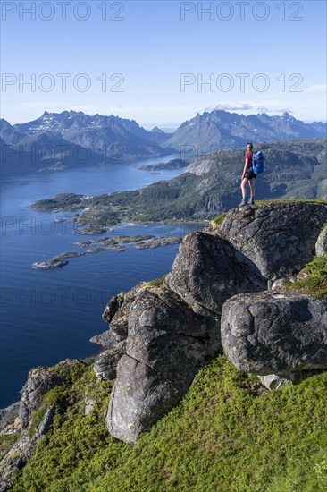 Young hiker looking at mountain panorama