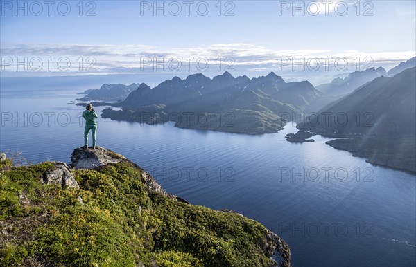 Young hiker looking at mountain panorama