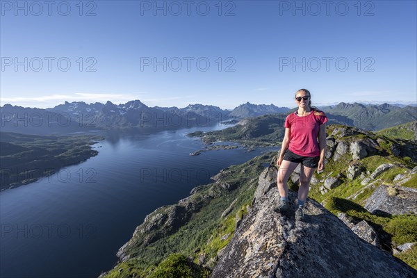 Young hiker standing on rocks