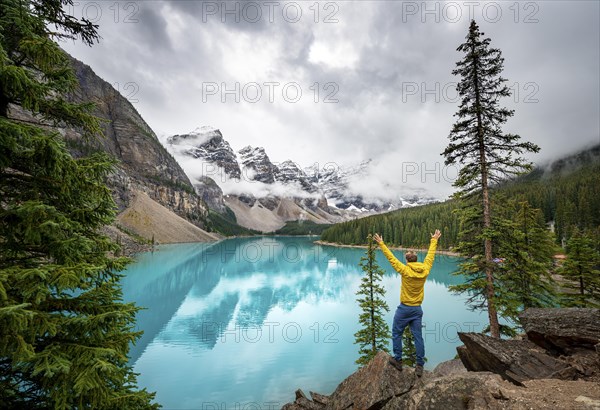 Young man stretching his arms in the air