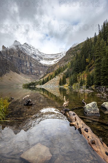 Cloudy mountains reflected in the lake