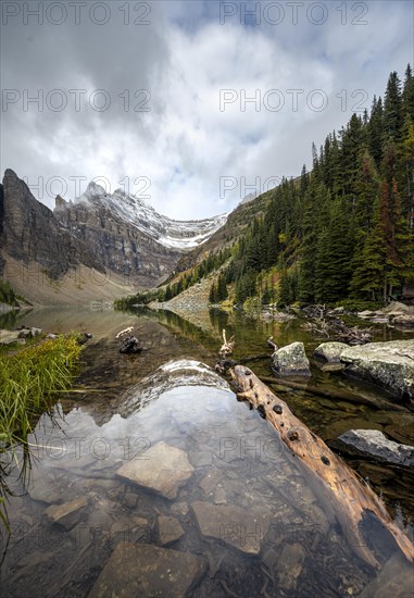 Cloudy mountains reflected in the lake