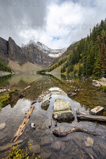 Cloudy mountains reflected in the lake