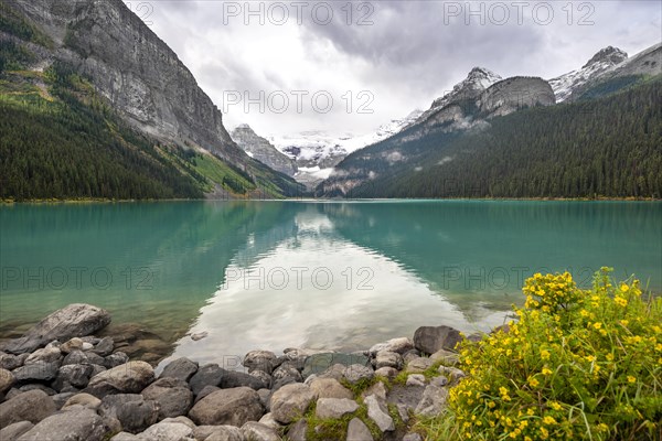 Mountains reflected in turquoise lake