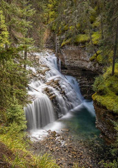 Waterfall flowing in cascades