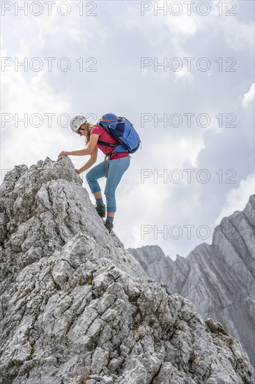 Young female hiker with helmet