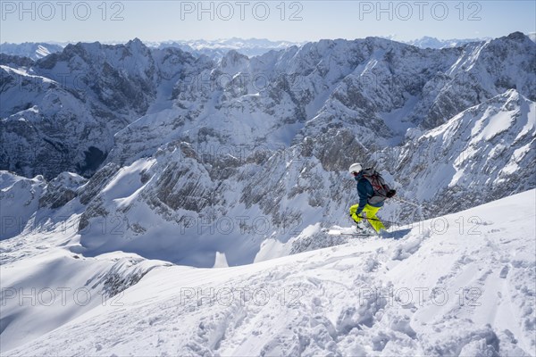 Ski tourers on the descent from the Alpspitz east slope