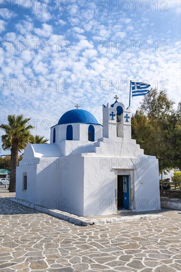 Blue and White Greek Orthodox Church Agios Nikolaos with Greek Flag