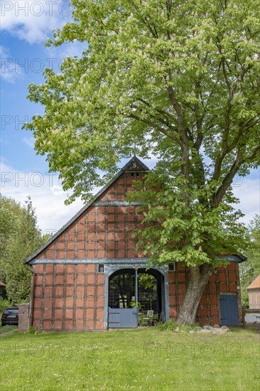 Half-timbered house in the round village of Satemin