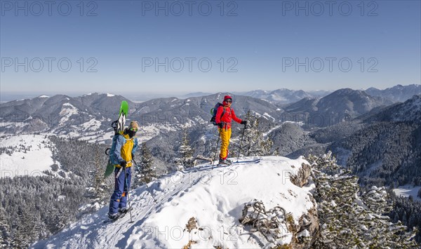 Young woman and man on ski tour