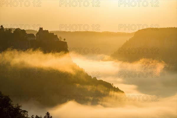 View from Eichfelsen to Werenwag Castle with morning fog