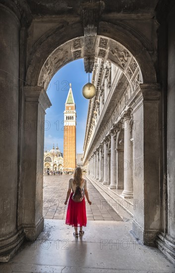 Young woman in portico at St. Mark's Square