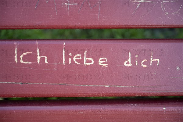 On a park bench engraved lettering I love you Germany