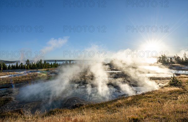 View of steaming hot springs in the morning sun