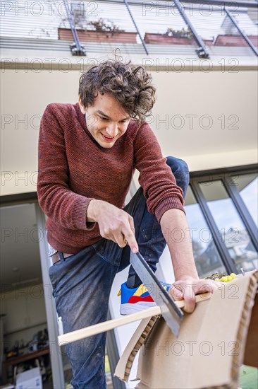 Young man doing DIY in his apartment