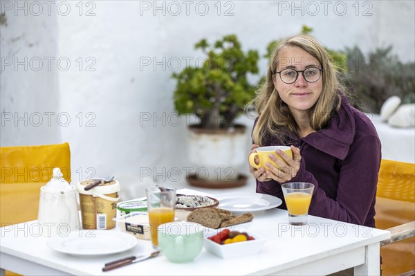 Young woman having breakfast