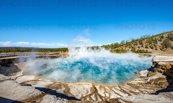 Hot spring with steaming turquoise water