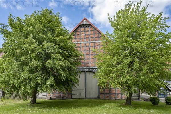 Half-timbered house in the round village of Satemin