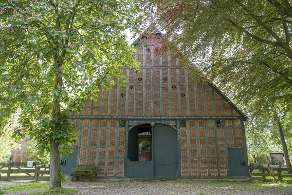 Half-timbered house in the round village Satemin