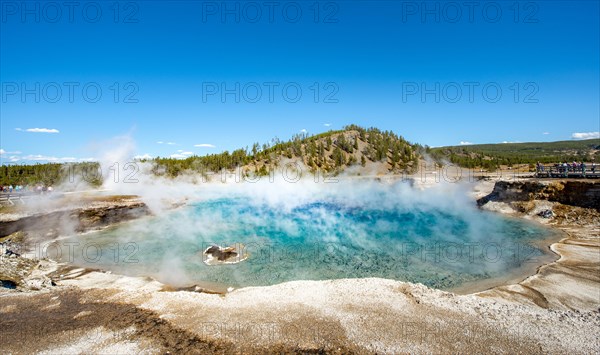 Hot spring with steaming turquoise water