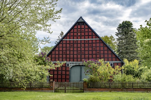 Half-timbered house in the round village of Satemin