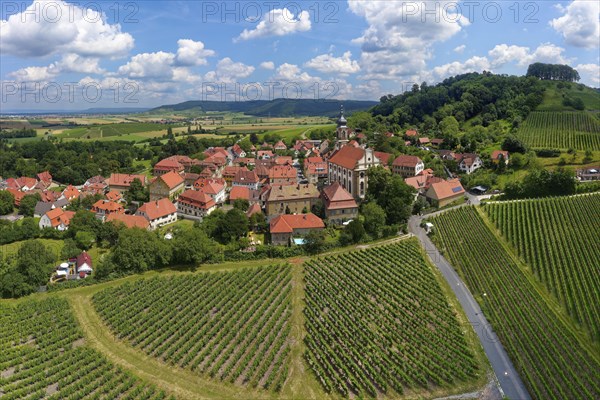 Village center wine village Castell with county church St. Johannes and vineyard Schlossberg