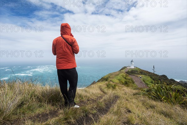 Guy infront of Cape Reinga Lighthouse