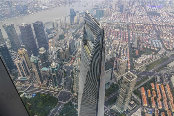 View from the highest observatory of the world on 562 meters height in the 632 meters high skyscraper Shanghai Tower to the special economic zone Pudong with the 492 meters high Shanghai World Financial Center
