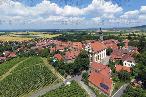 Village center wine village Castell with county church St. Johannes and vineyard Schlossberg