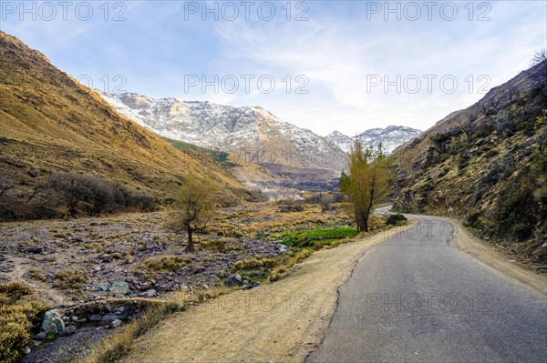 Beautiful valley with stream in Atlas mountain by sunset