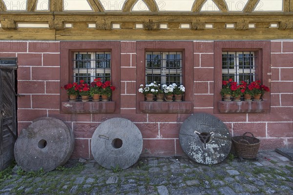 Old millstones in front of the flour mill