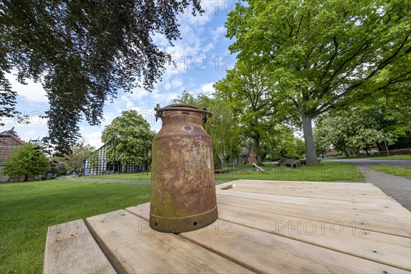 Old milk can in the village center of the Rundlingsdorf Satemin