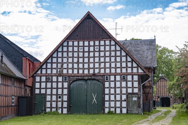 Half-timbered house in the round village of Satemin