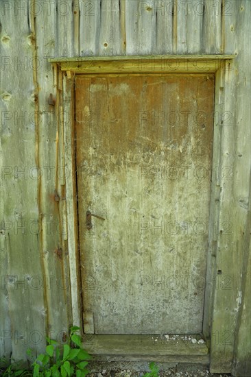 Old door in a field barn