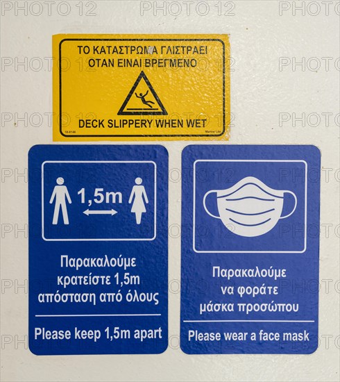 Warning and information signs on a Greek ferry